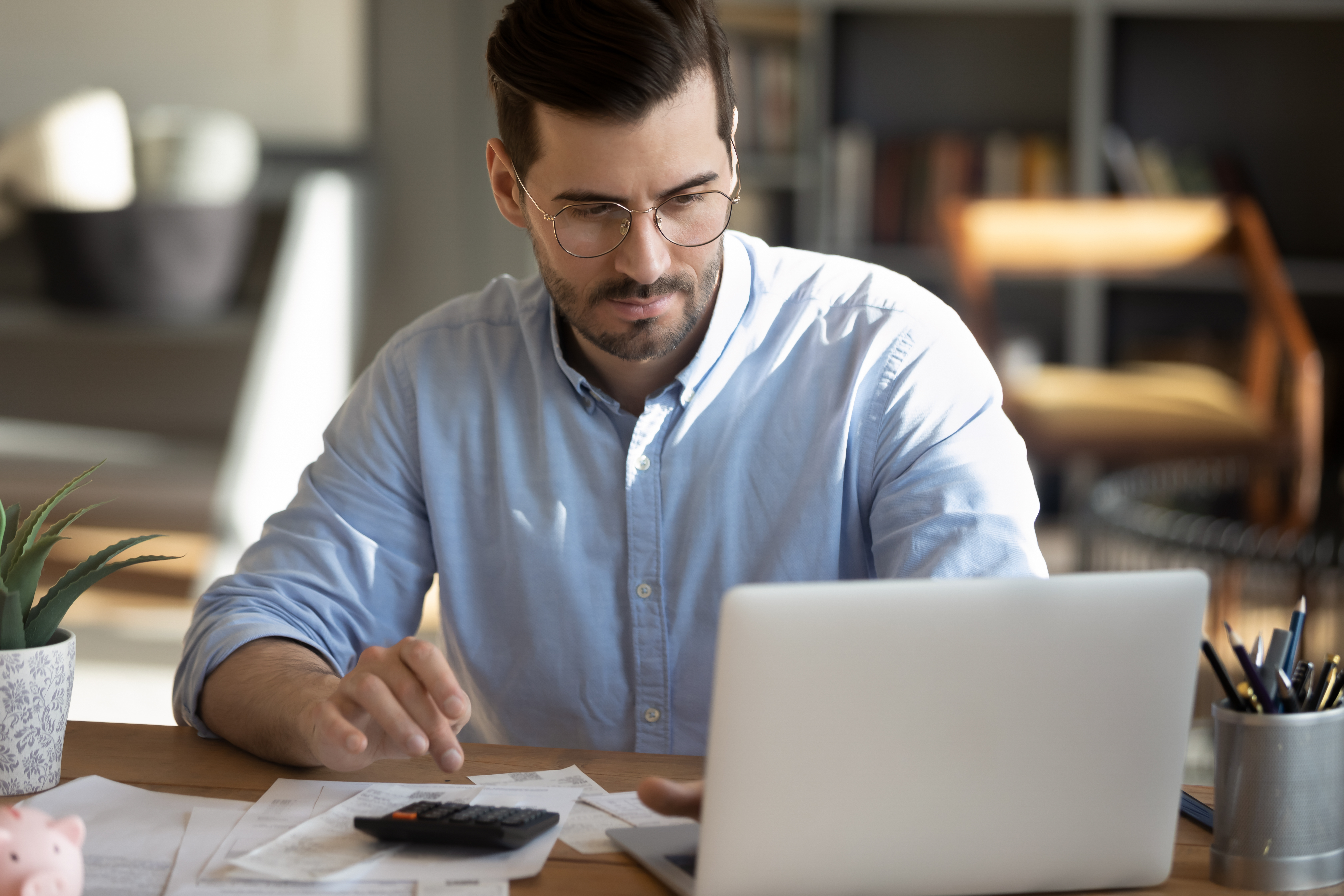 Happy business owner using technology